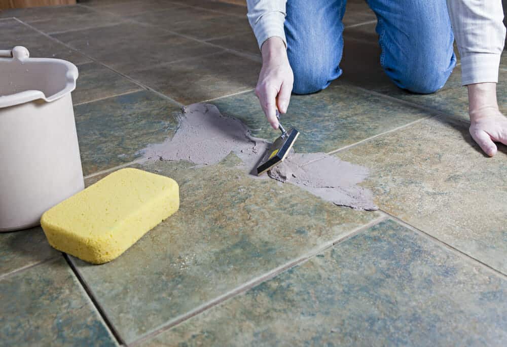 applying grout to tile