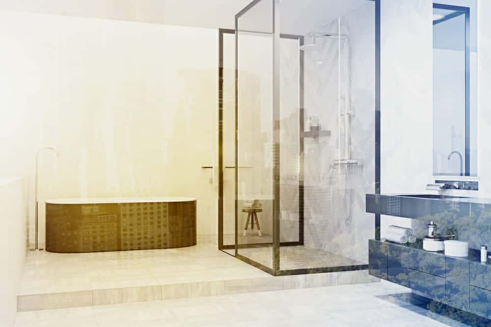 Golden bathroom with corner glass shower