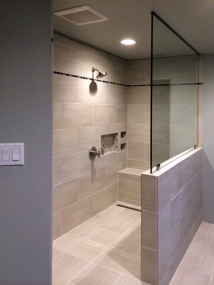 Shower Doors of Austin - Go Frameless Austin - showcases this stunning shower with pony wall & splash panel