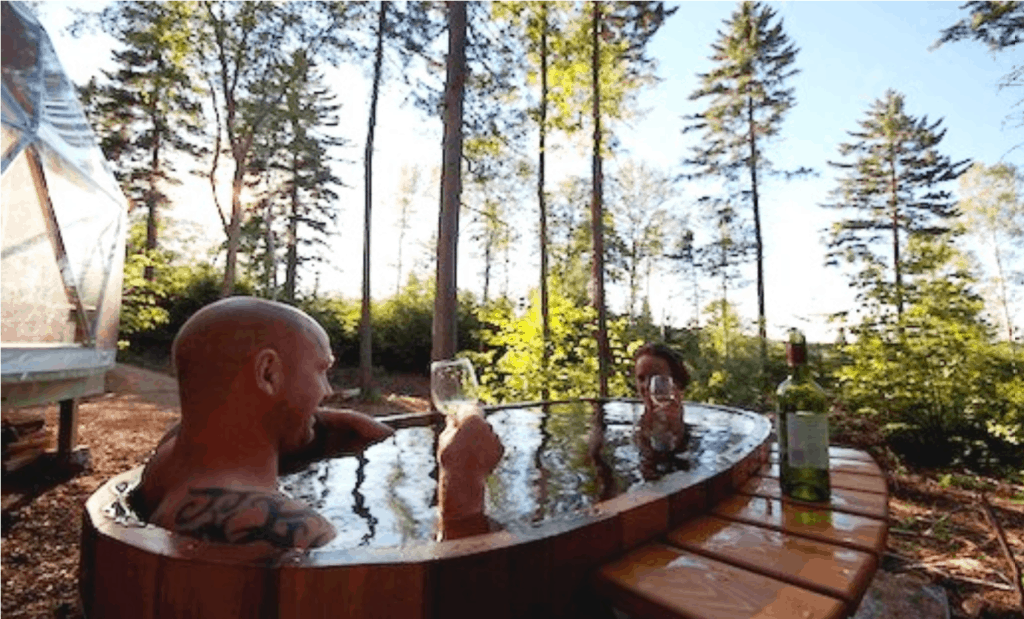 Couple enjoying a glass of wine - Northern Lights Cedar Tubs and Saunas