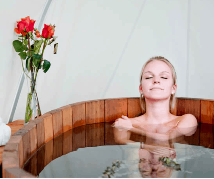 Woman Relaxing in Hot Ofuro Japanese Soaking Tub from Northern Lights